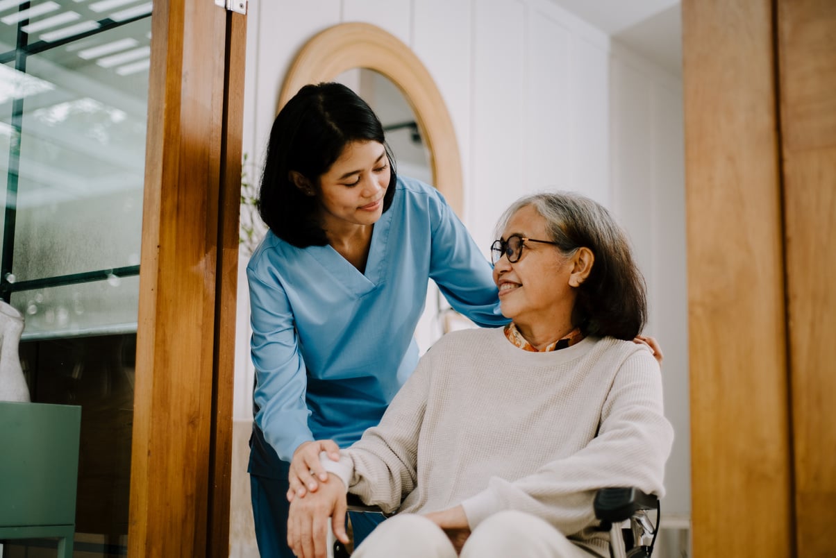 Nurse Taking Care of an Elderly Woman 